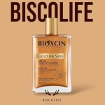 روغن مرطوب کننده و شاین صورت بدن و مو بیوکسین مدل Gold On Skin حجم 100 میل